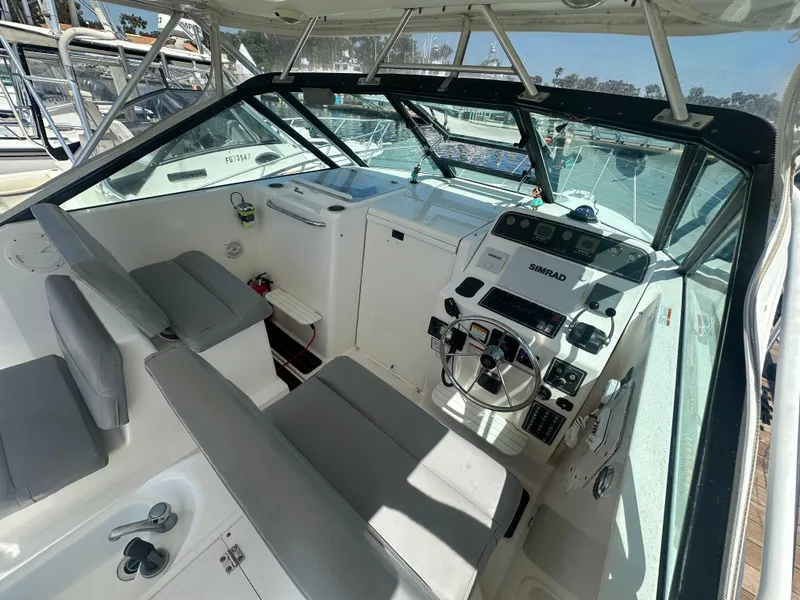 Slide: The Image of 2006 Tiara Yachts 2900 cockpit with steering wheel, navigation equipment, and seating. - 9