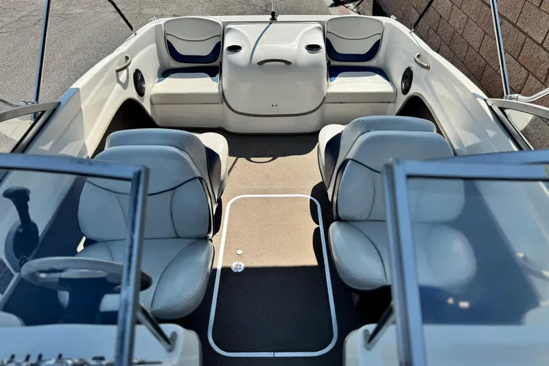 Slide: The Image of 2004 Bayliner 175 Bowrider interior with seating and steering wheel, showcasing spacious design. - 12