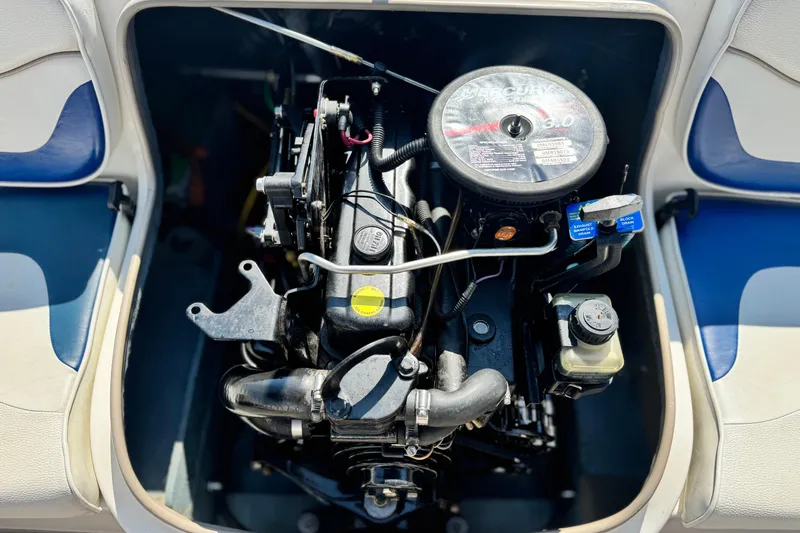 Slide: The Image of Engine compartment of a 2004 Bayliner 175 Bowrider, showcasing the MerCruiser engine. - 15