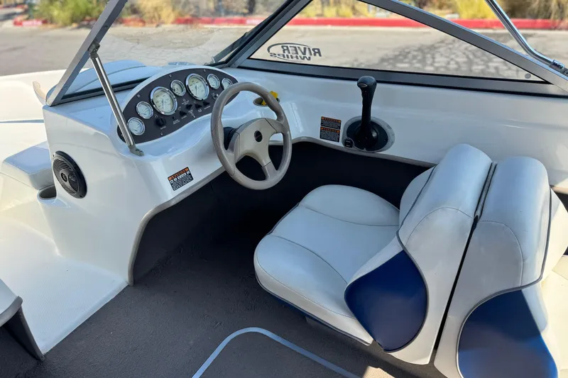 Slide: The Image of 2004 Bayliner 175 Bowrider interior with steering wheel and dashboard controls. - 22