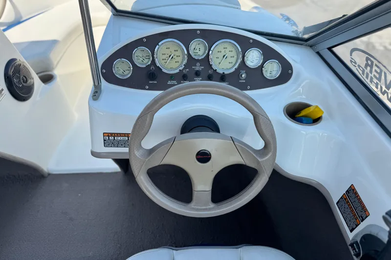 Slide: The Image of 2004 Bayliner 175 Bowrider dashboard with steering wheel and instrument panel. - 23