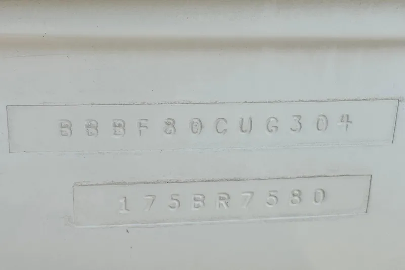 Slide: The Image of 2004 Bayliner 175 Bowrider hull identification number and model code embossed on surface. - 26