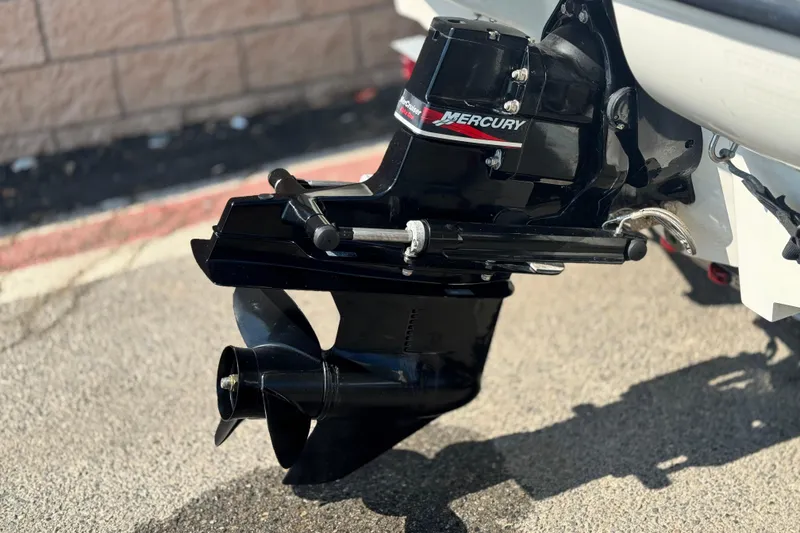 Slide: The Image of 2004 Bayliner 175 Bowrider with Mercury outboard motor, close-up view. - 6