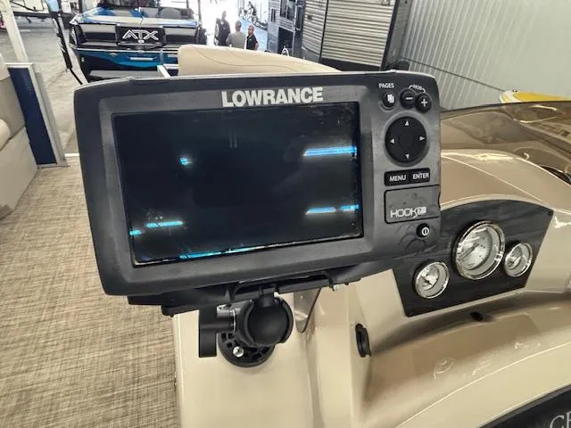 Slide: The Image of Fishfinder on 2020 Harris Cruiser 210 boat dashboard with gauges. - 10