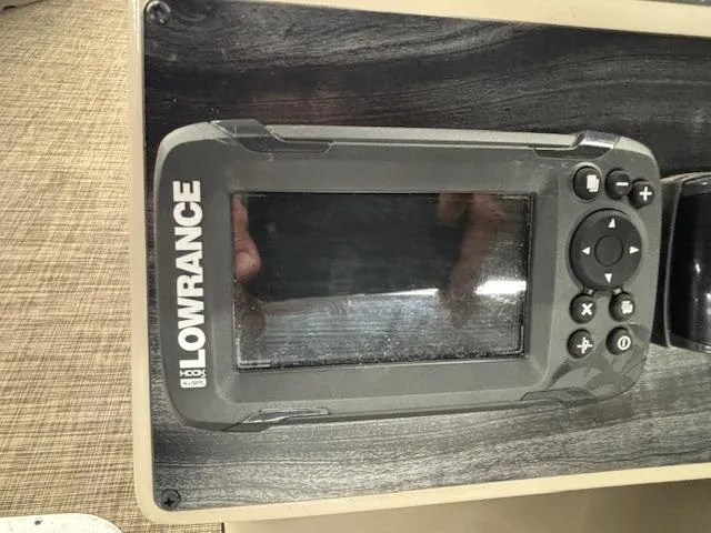 Slide: The Image of Lowrance fish finder on 2020 Harris Cruiser 210 boat dashboard. - 12