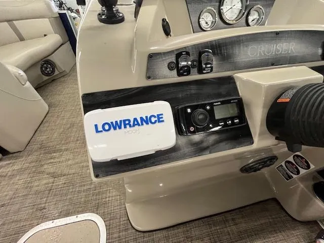 Slide: The Image of Control panel of a 2020 Harris Cruiser 210 boat with Lowrance navigation system. - 13