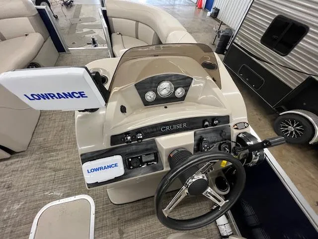 Slide: The Image of 2020 Harris Cruiser 210 boat dashboard with Lowrance navigation system and steering wheel. - 14