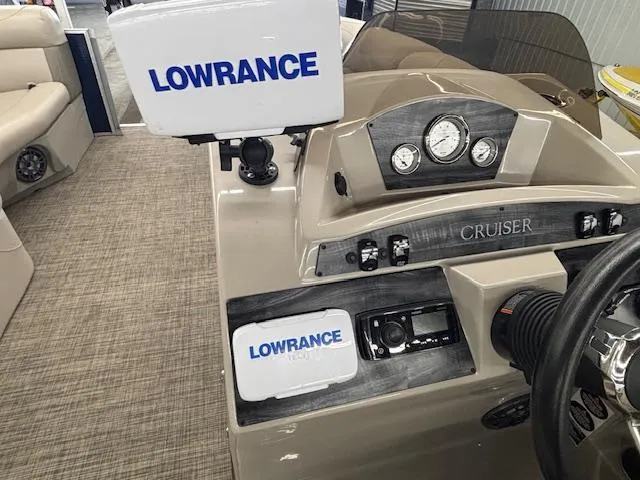 Slide: The Image of 2020 Harris Cruiser 210 dashboard with Lowrance navigation system and gauges. - 15