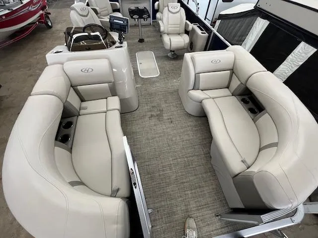 Slide: The Image of 2020 Harris Cruiser 210 pontoon boat interior with plush seating and modern design. - 18