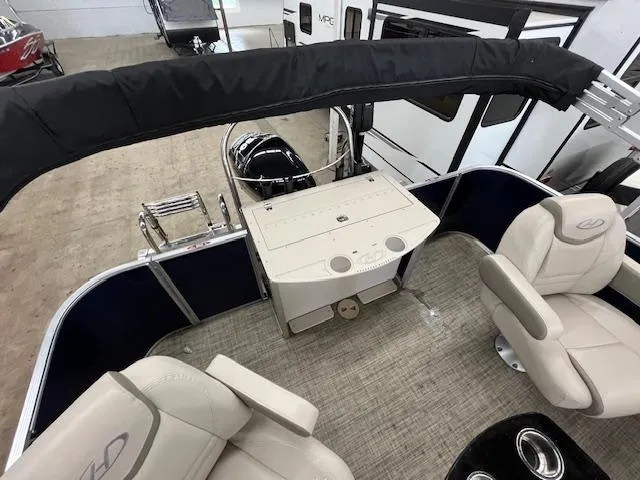 Slide: The Image of 2020 Harris Cruiser 210 boat interior with seating and helm station. - 9