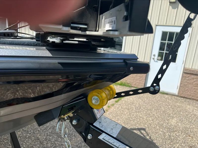 Slide: The Image of Close-up of 2016 Crestliner Raptor 1850 boat trailer hitch and roller mechanism. - 20