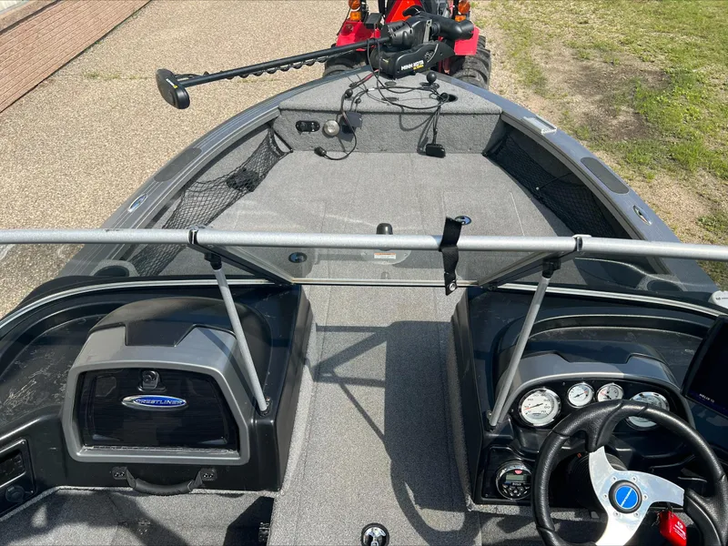 Slide: The Image of 2016 Crestliner Raptor 1850 boat interior with steering wheel and control panel. - 3