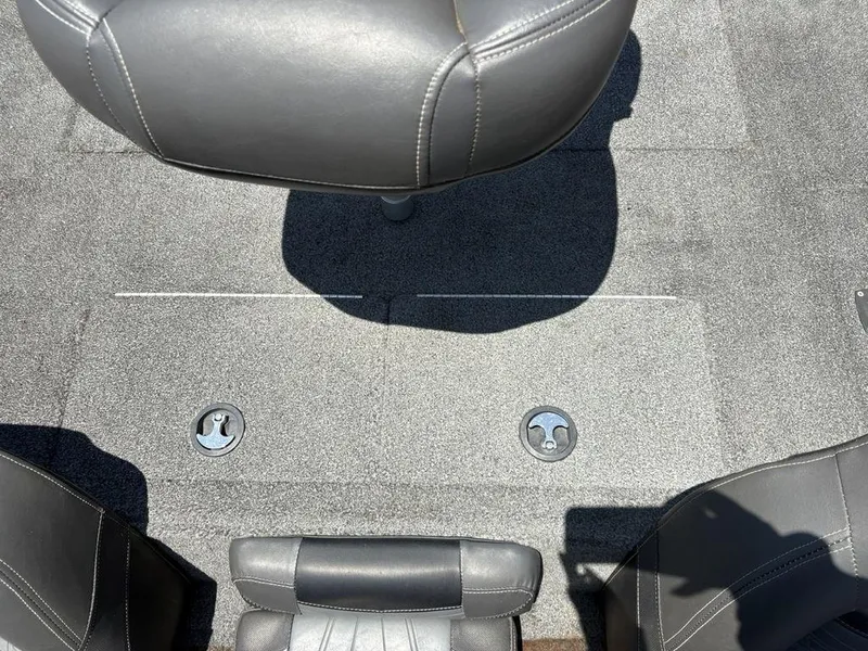 Slide: The Image of 2019 Tracker Pro Team™ 195 TXW boat interior with gray seating and carpeted floor. - 12