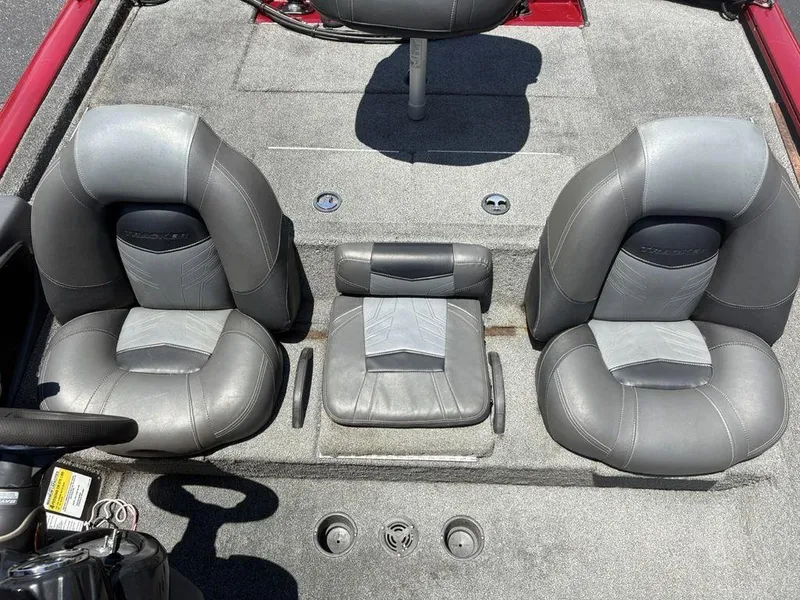 Slide: The Image of 2019 Tracker Pro Team™ 195 TXW boat interior with gray seating and carpeted floor. - 15
