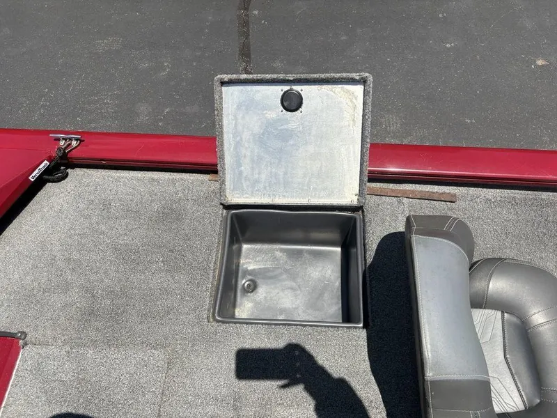 Slide: The Image of 2019 Tracker Pro Team™ 195 TXW boat with open storage compartment and seating. - 23