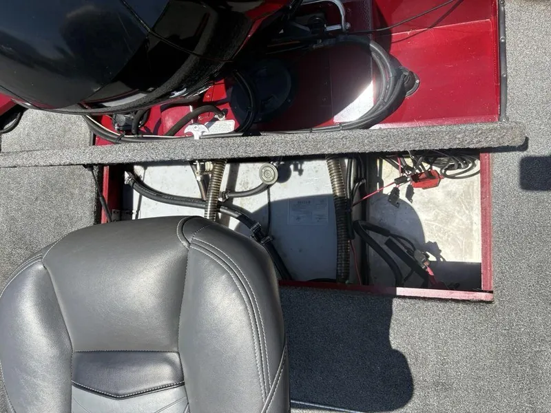 Slide: The Image of 2019 Tracker Pro Team™ 195 TXW boat interior with open compartment and seat. - 24