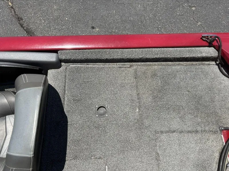 Slide: The Image of Interior view of 2019 Tracker Pro Team™ 195 TXW boat, featuring gray carpet and seating. - 25