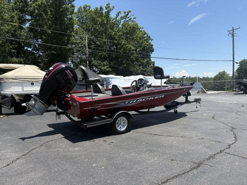 Slide: The Image of 2019 Tracker Pro Team™ 195 TXW boat on trailer, parked outdoors. - 8