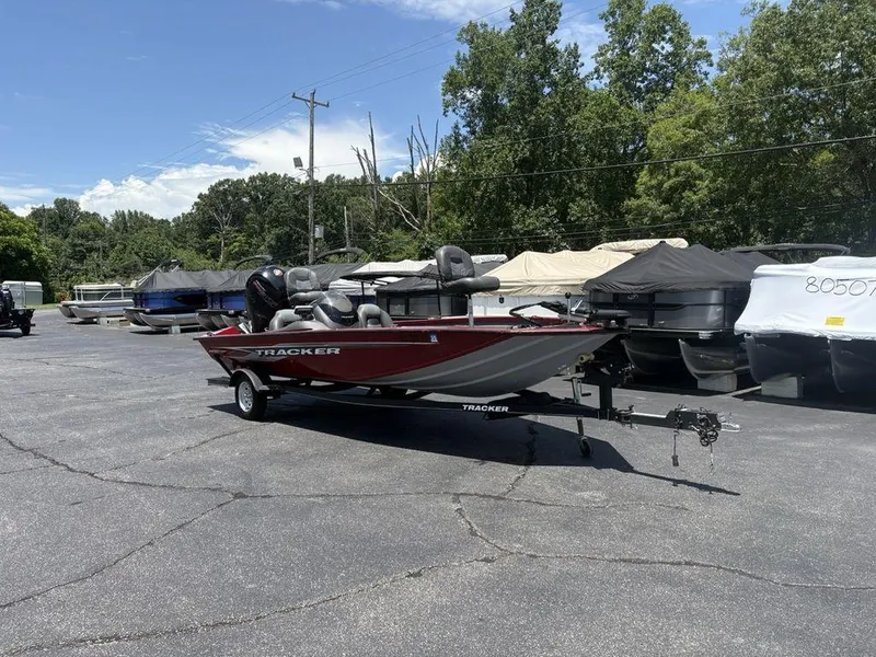 Slide: The Image of 2019 Tracker Pro Team™ 195 TXW boat on trailer in outdoor lot. - 9