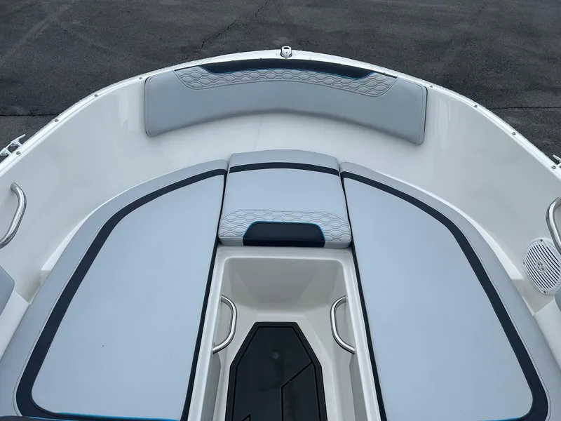 Slide: The Image of 2023 Bayliner Element M17 boat interior with cushioned seating and storage compartment. - 4