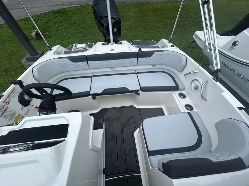 Slide: The Image of 2023 Bayliner Element M17 boat interior with seating and steering wheel. - 6