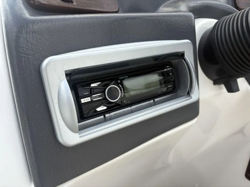 Slide: The Image of 2013 Godfrey AP250 RL dashboard with Sony marine stereo system. - 18