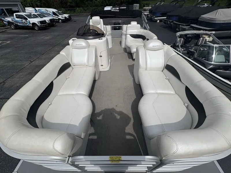 Slide: The Image of 2013 Godfrey AP250 RL pontoon boat with spacious white seating and modern design. - 26