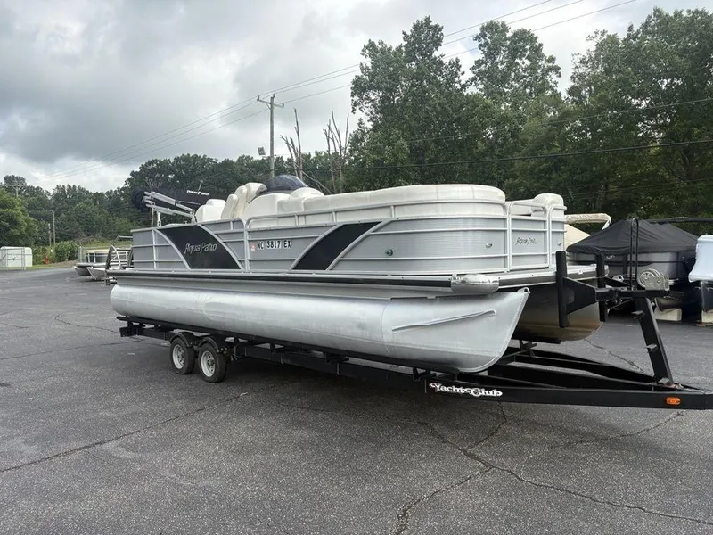 Slide: The Image of 2013 Godfrey AP250 RL pontoon boat on trailer, parked outdoors. - 4