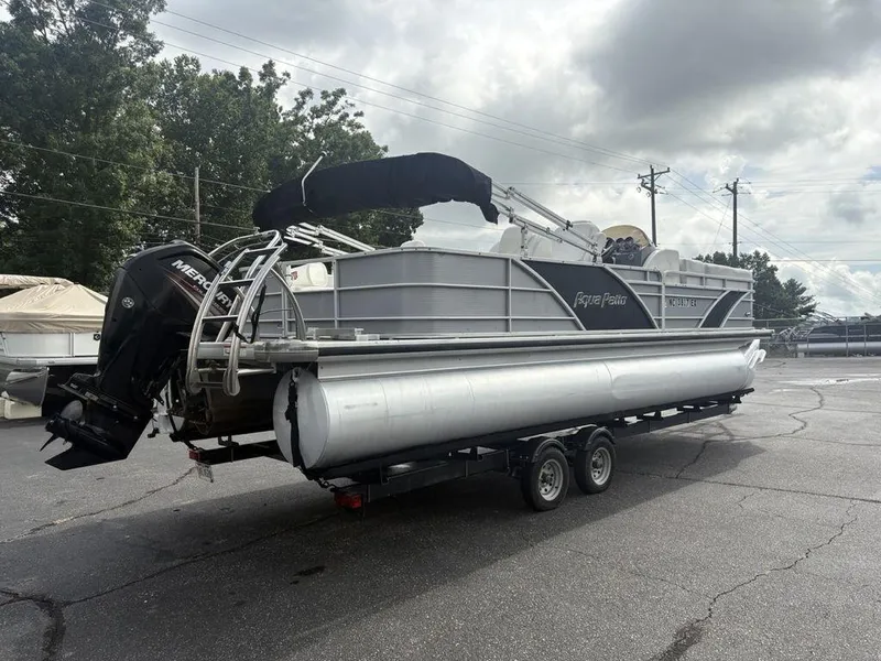 Slide: The Image of 2013 Godfrey AP250 RL pontoon boat on trailer, featuring Mercury outboard motor. - 5