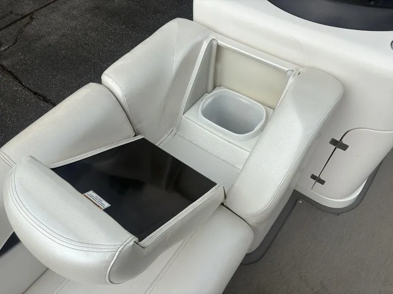 Slide: The Image of White leather seating with storage compartment on 2013 Godfrey AP250 RL boat. - 8