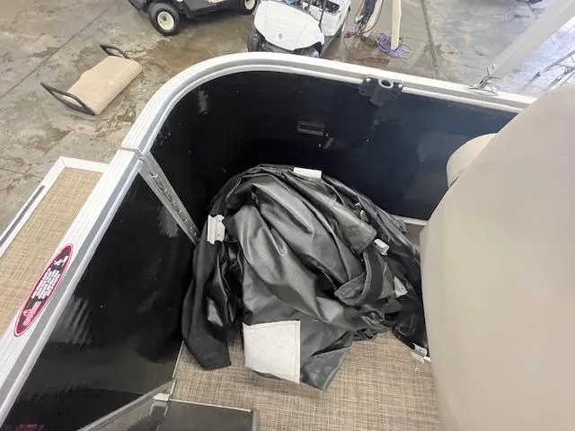 Slide: The Image of 2017 Harris Cruiser 200 interior with folded black cover on floor. - 10