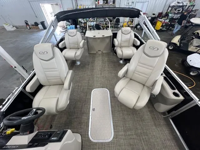 Slide: The Image of Interior of a 2017 Harris Cruiser 200 pontoon boat with beige seating. - 16