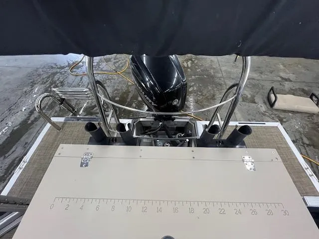 Slide: The Image of 2017 Harris Cruiser 200 boat deck with motor and measuring board. - 8