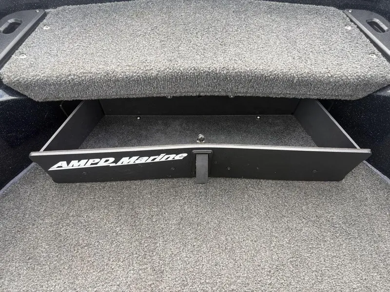 Slide: The Image of Open storage compartment in 2023 Skeeter ZXR 20 boat with AMPD Marine branding. - 10