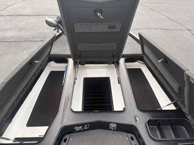 Slide: The Image of 2023 Skeeter ZXR 20 boat storage compartments open, showcasing spacious interior design. - 14