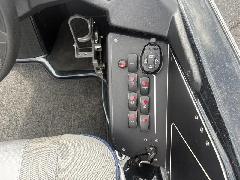 Slide: The Image of Control panel of 2023 Skeeter ZXR 20 boat with switches and foot pedal. - 21