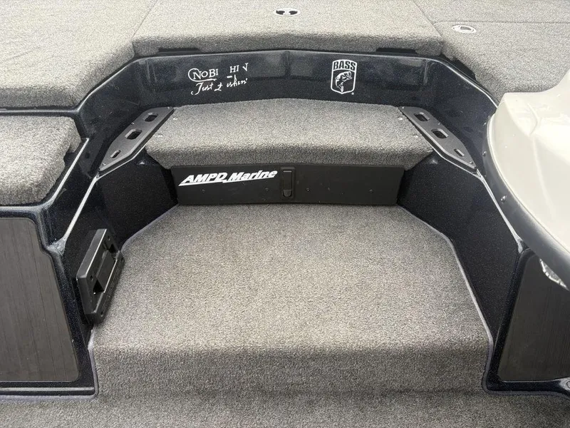 Slide: The Image of 2023 Skeeter ZXR 20 boat interior with carpeted steps and AMPD Marine branding. - 7