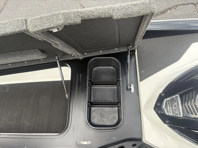 Slide: The Image of Open storage compartment in 2023 Skeeter ZXR 20 boat, showcasing interior details. - 9