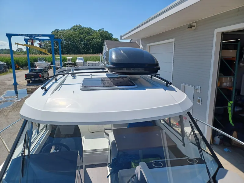 Slide: The Image of 2022 Jeanneau NC Weekender 795 Series 2 boat at a marina, roof view. - 11
