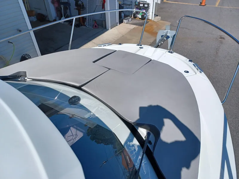 Slide: The Image of 2022 Jeanneau NC Weekender 795 Series 2 boat deck with sunpad and railing. - 13