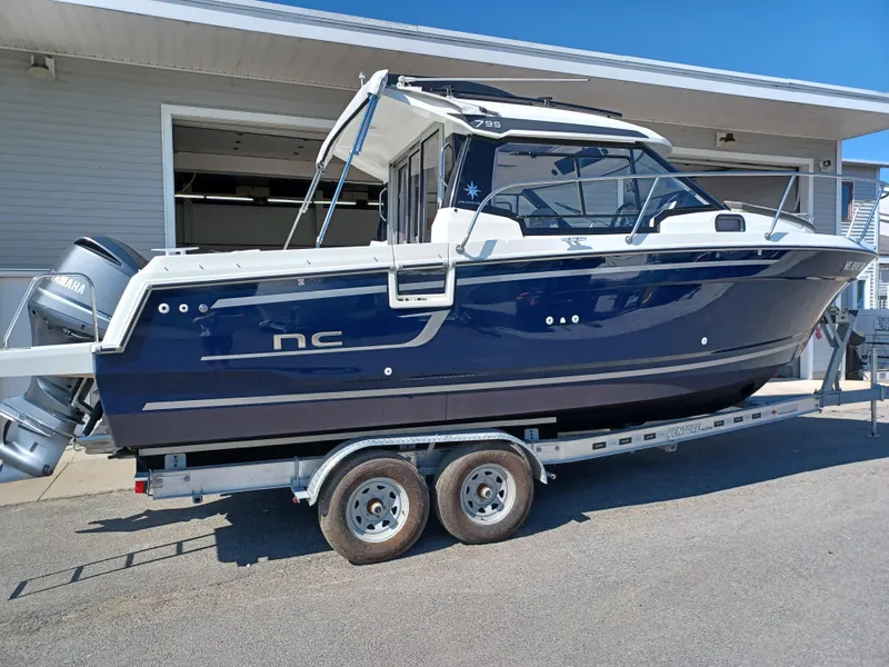 Slide: The Image of 2022 Jeanneau NC Weekender 795 Series 2 boat on trailer, side view. - 15