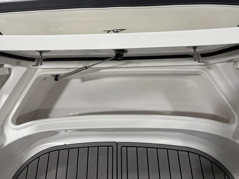 Slide: The Image of Open storage compartment of 2026 Tidewater 2700 CB boat, featuring sleek design and durable materials. - 15