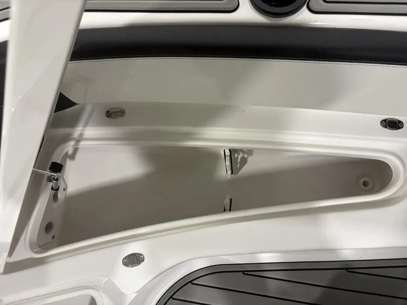Slide: The Image of Open storage compartment on 2026 Tidewater 2700 CB boat, featuring sleek interior design. - 17