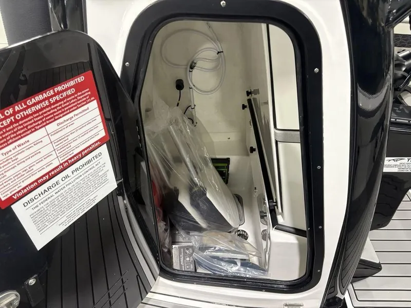 Slide: The Image of 2026 Tidewater 2700 CB storage compartment with safety and discharge instructions. - 20