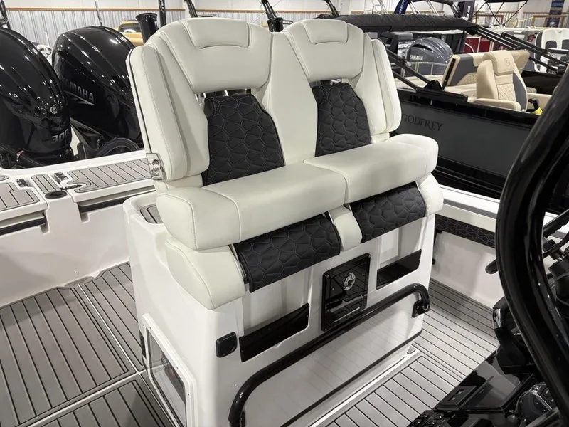 Slide: The Image of 2026 Tidewater 2700 CB boat seating with dual cushioned seats and sleek design. - 23