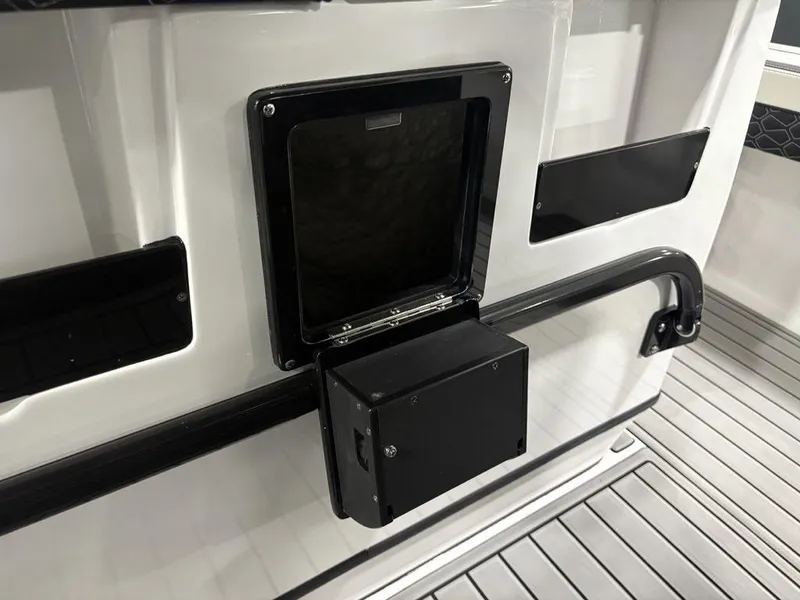 Slide: The Image of 2026 Tidewater 2700 CB boat interior with sleek black and white design elements. - 24