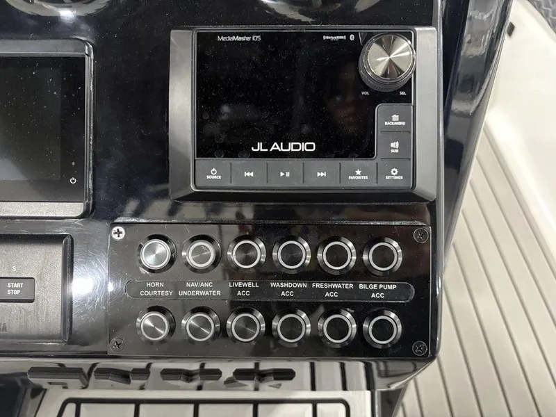 Slide: The Image of Control panel of 2026 Tidewater 2700 CB boat with JL Audio system and switches. - 25