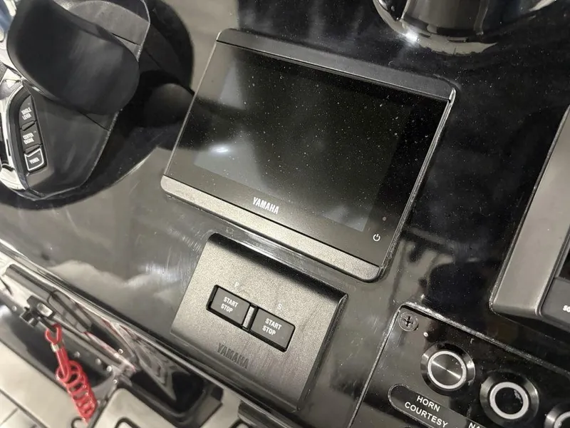 Slide: The Image of Control panel of a 2026 Tidewater 2700 CB boat featuring a Yamaha display. - 28