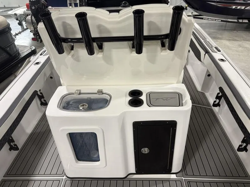 Slide: The Image of 2026 Tidewater 2700 CB boat interior with rod holders and storage compartments. - 32