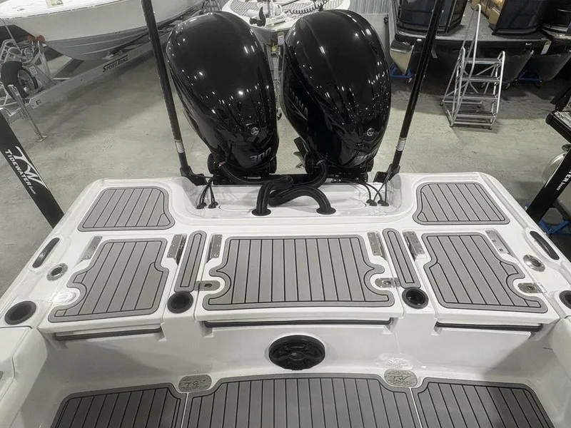 Slide: The Image of 2026 Tidewater 2700 CB boat with dual outboard engines and sleek deck design. - 35